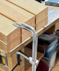 Beefy 4 Pack 12 Inch Welding Bar Clamps Drop Forged Steel With 3 Inch Throat And 450 Lb Clamp Force in use on wooden planks