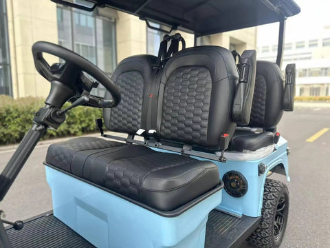 Slick Four Seater Electric Golf Cart Boasting Ridiculously Comfy Luxury Seats And Knobby Antislip Tires With A Sharp Hd Led Display For A Real Smooth Weekend Ride In Light Blue interior view showing luxury seats and steering wheel.