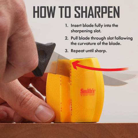 Using Two Step Knife Sharpener with Coarse and Fine Slots, yellow, portable tool on a knife, close-up of sharpening action.