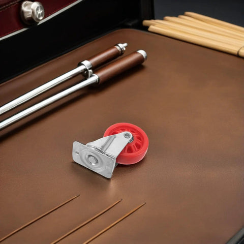 Hella Smooth Nylon Caster Wheels For Mechanic Creepers Providing Straight Up Quiet Rollout And Rock Solid Swivel Control For Effortless Shop Floor Cruising on a brown leather surface.