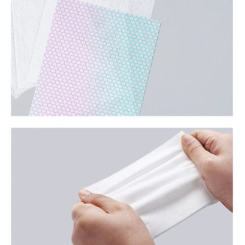 100 Count Dye Grabber Laundry Tablets With Color Catcher Power, fast absorbing dye guard sheet being stretched by hands