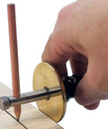 Slick Woodworkers Dovetail Marking Gauge With Cam Lever Lock And Interchangeable Blades For Easy Setup No Fuss Precision Scribing In Inches Or Millimeters Heavy Duty Shop Essential being used to mark wood.