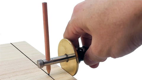 Slick Woodworkers Dovetail Marking Gauge With Cam Lever Lock And Interchangeable Blades For Easy Setup No Fuss Precision Scribing In Inches Or Millimeters Heavy Duty Shop Essential being used to mark wood.