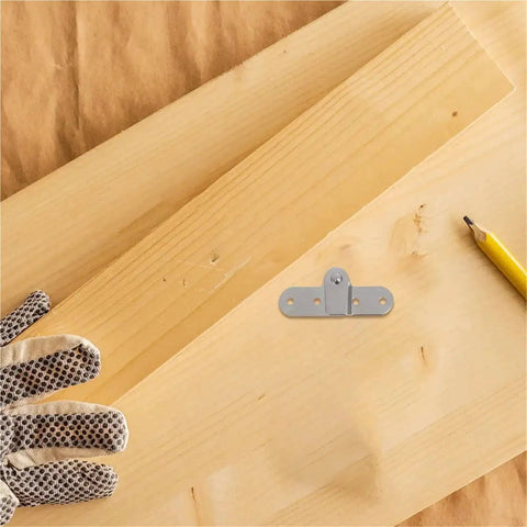Six Piece Heavy Duty Folding Hinge Set for Attic Ladders and Table Legs displayed with wood and a glove.