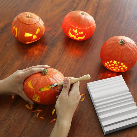 Wood Carving Sharpener 1000 Grit Whetstone With Extra Grooves For Chisels And Gouges on a table with carved pumpkins