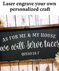 Front view: wooden-framed black chalkboard sign with white cursive lettering and decorative sunflowers.