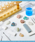 Mohs Hardness Test Kit 11 Piece Mineral Discovery Set with 9 Rock Specimens and 2 Unglazed Porcelain Streak Plates for Easy Hands On Mineral Identification, Geology Learning, Earth Science Practice displayed on table with test tube rack