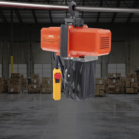 VEVOR electric chain hoist with orange housing and black chain bag, yellow wired remote, installed on overhead crane.