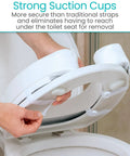 Hands attaching Toilet Seat Cushion Soft Foam Donut Pad For Elongated And Standard Seats, showing strong suction cups.