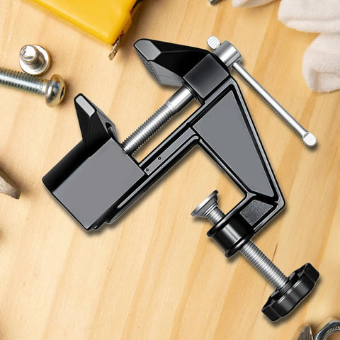 Heavy Duty Mini Work Bench Vise With Adjustable Quick Release Clamp for secure material handling on wood surface.