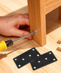 Heavy Duty Matte Black Stainless Steel Mending Plates 4 Pack With Screws during installation on wooden furniture.