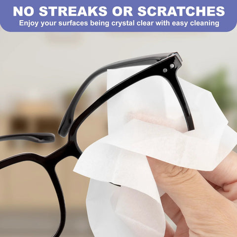 Eyeglasses anti-fog wipes used on black frames; close-up view.