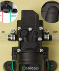 12 Volt Fresh Water Pump For RV Camper Boat And Lawn With Self Priming Diaphragm, close-up of inlet and outlet with hose clamps.