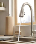 Precept Pull-Down Kitchen Faucet, 1.5 GPM Flow, Stainless Finish, 3-Function Sprayer With POWERinse in modern kitchen setting