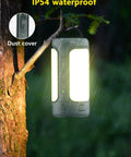 Rechargeable 3-In-1 Camping Lantern With Foldable Tent Light And Handheld Flashlight hung on a tree in rain