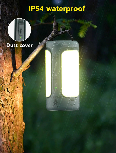 Rechargeable 3-In-1 Camping Lantern With Foldable Tent Light And Handheld Flashlight hung on a tree in rain