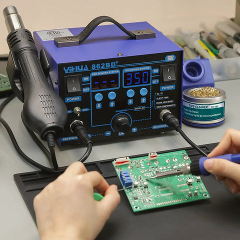 Hands using 862BD+ 2-In-1 Soldering Iron And Hot Air Rework Station With Fahrenheit And Celsius Temperature Control on circuit board