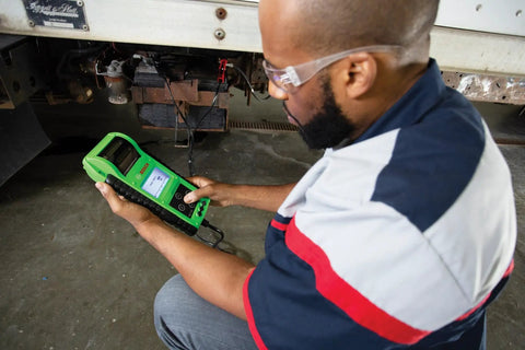 Pro Grade Heavy Duty Battery And Electrical System Tester For Commercial Vehicles With Dynamic Resistance Tech Delivers Fast Accurate 6V And 12V Battery Tests From 100 To 6000 Cold Cranking Amps, handheld tester in use