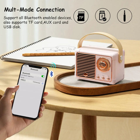 Retro Bluetooth Speaker Portable Wireless Speaker with Crystal Clear Stereo Sound and Rich Bass Pink Color Ideal Gift Idea on desk with phone showing Bluetooth connection
