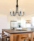 6 Light Black Crystal Chandelier With Chic Farmhouse Rustic Black Metal Frame hanging in a modern kitchen setting.