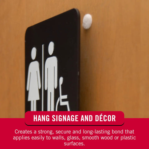Heavy Duty Adhesive Hook And Loop Dots For Smooth Surfaces Medium Black 3/4 Inch Circles 200 Pack on a door for hanging signage.