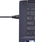 Cat6 Ethernet Patch Cable 25 Ft Long With Gold-Plated RJ45 Connectors, Lag-Free Gaming Ready, 1 Gbps Speed, Gigabit Ethernet For Router Modem Switch, Black, Durable High-Performance Network Cable connected to a laptop keyboard