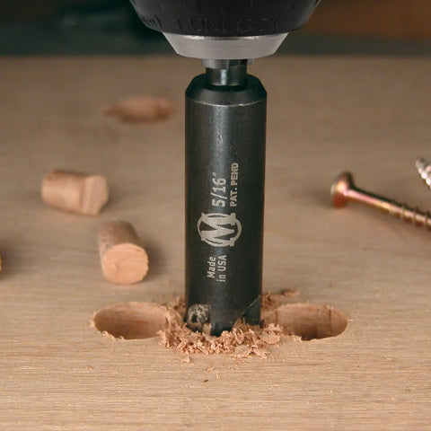 Close-up of Absolute Game Changer 25 Pc Woodworker Drill Bit Set featuring self-centering cutter on wood.