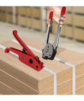 Heavy Duty Manual Strapping Machine Kit With Tensioner And Sealer For Secure Pallet Wrapping, aluminum and steel tools on wooden pallets.
