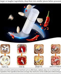 Compact Electric Mini Vegetable Chopper, USB Rechargeable Garlic Slicer And Onion Dicer with ingredients flying during chopping.