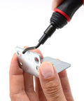 Person using the Super Easy Reach Extension Deburring Tool With 16 HSS Swivel Blades on a metal plate.