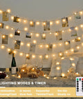 Warm White 100 LED Globe Battery Operated Christmas Lights Indoor With Eight Modes For Cozy Dorm Room Bedroom Or Tree Decor Soft Glow Easy On Battery Perfect For Year Round Holiday Vibes, decorating a wall with photos and pillows below.