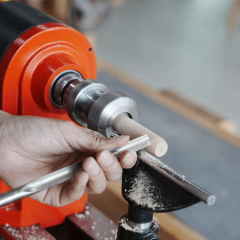 Crush Complex Turns On Your Lathe With This Badass ER32 Collet Chuck Kit featuring a lathe in use, showing precision wood shaping.