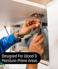 Stainless steel lag bolts 3/8 x 1-1/2 in being installed under cabinet with a screwdriver