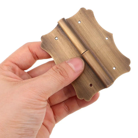 Person holding Heavy Duty Copper Door And Window Hinge With Vintage Retro Style And Decorative Edges For Smooth Operation Built Tough