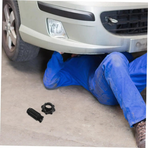 Mechanic under car with Durable Plastic Spare Tire Hold Down Bolt For Secure Mounting, Easy Installation beside on the floor