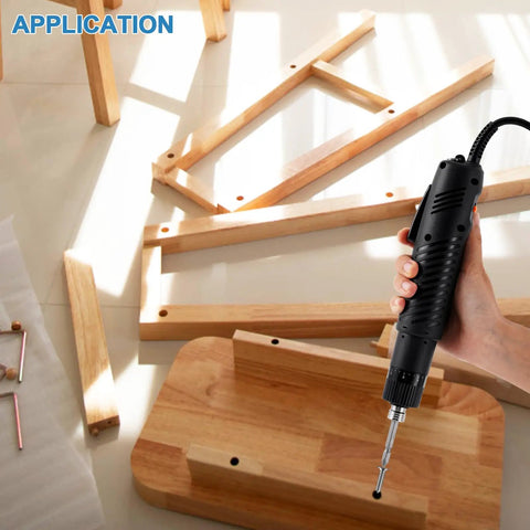 Using Electric Screwdriver Set With Adjustable Torque 5mm Chuck 110 220V for assembling wooden furniture, ergonomic handle visible