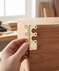 Hand applying 20 piece antique bronze corner protectors for tables and photo frames, alloy corner guards with prepunched holes