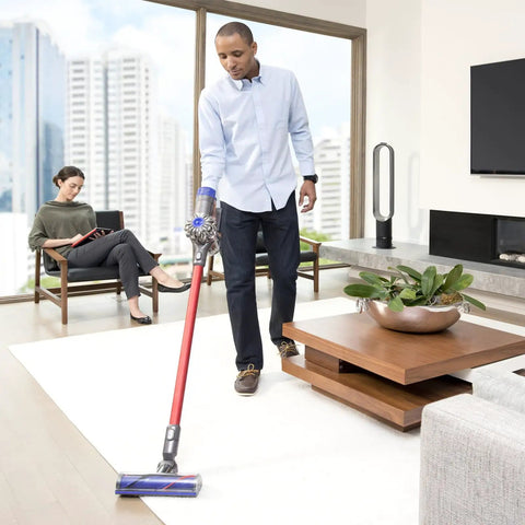 Person using Dyson Direct Drive Motorhead Cleaner Head Replacement for V6 DC58 DC59 DC62 DC72 DC74 on carpet in living room