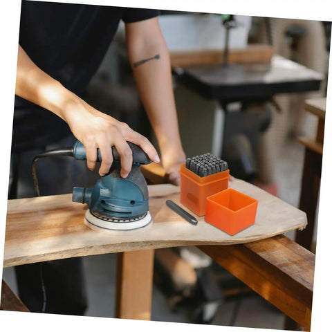 Person using sander beside 37 Piece Metal Number Letter Stamp Set With Heart Symbols For Crafting And Jewelry Making Includes A To Z And 0 To 9 Hearts