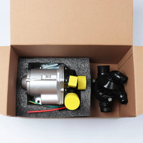 Heavy Duty Electric Water Pump And Thermostat A Hella Smooth Cooling Upgrade in box with yellow connectors and foam.