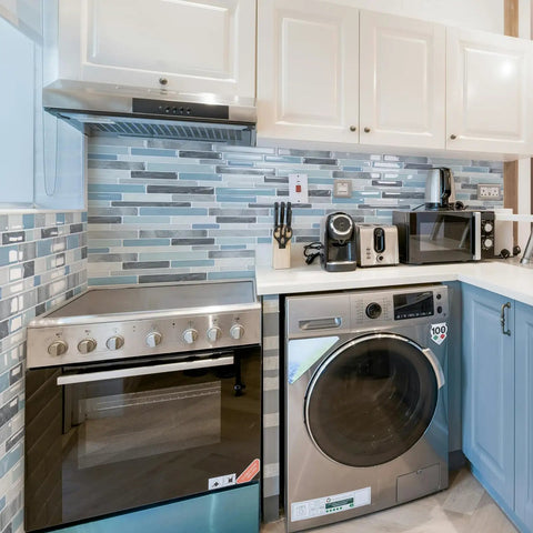 Self Adhesive Kitchen Backsplash Tiles With Marble Look For Quick Kitchen Remodel Peel And Stick 12 By 12 Inch Sheets Ten Tiles No Grout Needed Easy Install 40 Percent More Coverage Durable Cleanable Marble Finish installed behind kitchen appliances.
