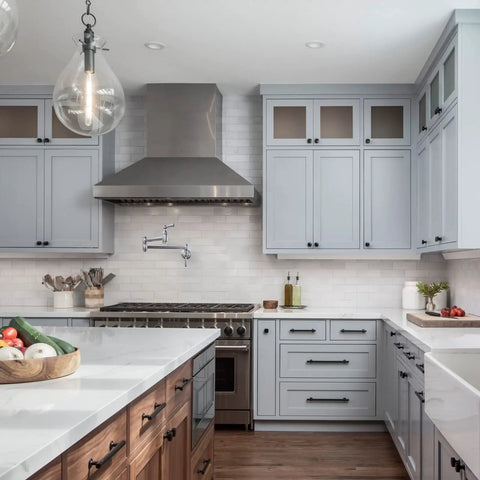 Modern kitchen with Chrome Pot Filler Faucet Wall Mount With Dual Handles And Double Joint Swing Arms visible above the stove.