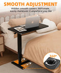 Adjustable Overbed Table With Wheels For Home Use, Extra Large 31.1 Inch By 15.3 Inch Bedside Tray Table shown next to bed with a laptop.