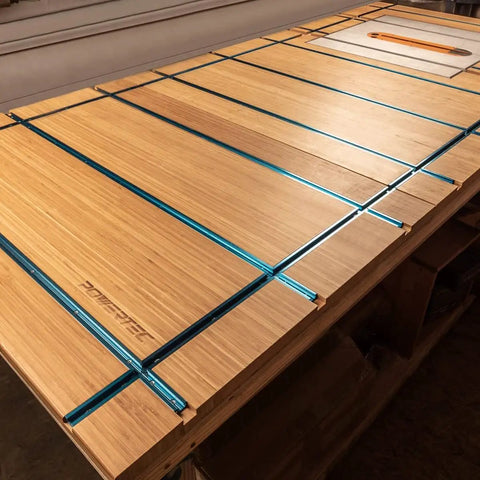 Double-Cut Universal T-Track And Intersection Kit, 4-Piece 48-Inch Aluminum T-Tracks installed on wooden workbench