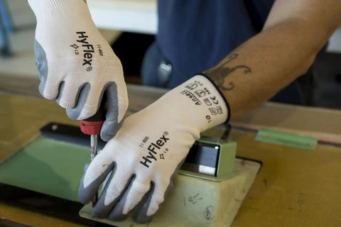 Person using HyFlex 11-800 Nylon Glove With Gray Foam Nitrile Coating, Knit Wrist Cuff, Size 8 Medium for precise tool work