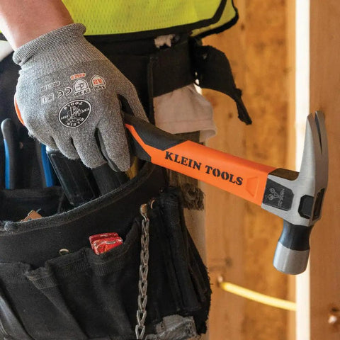 Person holding Heavy Hitting 16-Ounce Straight-Claw Hammer With Smooth Head, 13-Inch Length, Fiberglass Grip in tool belt.