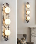Natural Marble Bathroom Vanity Light, Alabaster 3-Light Wall Sconce with glass shades on a polished Calacatta Viola marble base.