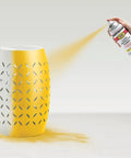 Tough As Nails Rust Eliminating Oil Based Spray Paint With Smooth Gloss Sunburst Yellow Finish for indoor ceramic vase being spray painted.