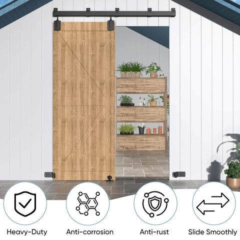 Heavy Duty Exterior Barn Door Hardware Kit For Outdoor Use With Box Rail Sliding Track Built To Last And Tough As Nails And Supports Up To 450 Lbs For One Door Black Finish Weather Resistant And Rustproof Ideal For Sheds Stables Garages And Workshops installed on a wooden door in outdoor setting