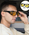 Man wearing Night Driving Glasses For Men And Women Anti Glare Polarized Yellow Lenses With HD Night Vision Wrap Around Fit Over Glasses
